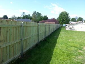 wooden fence with steel posts