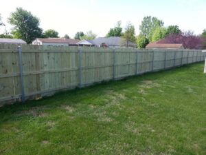 wooden fence with steel posts