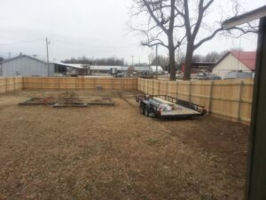 wooden fence with steel posts