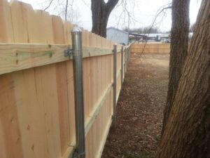 wooden fence with steel posts